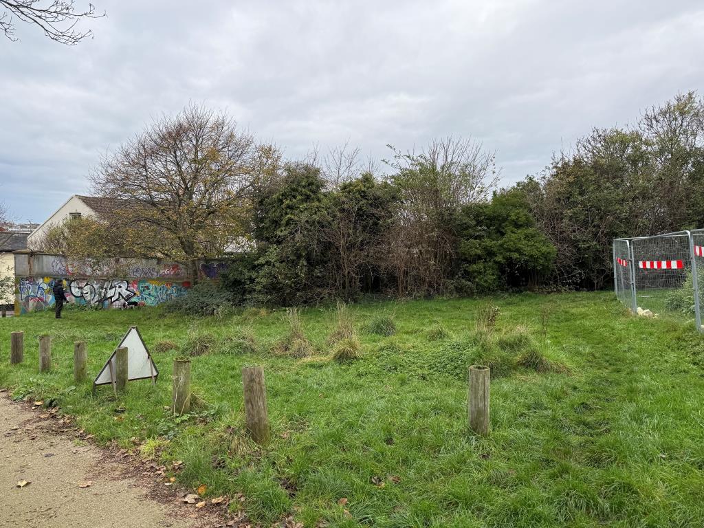 Lot: 90 - FORMER BUILDERS YARD WITH POTENTIAL (STNC) - Bouindary wall showing depth of site